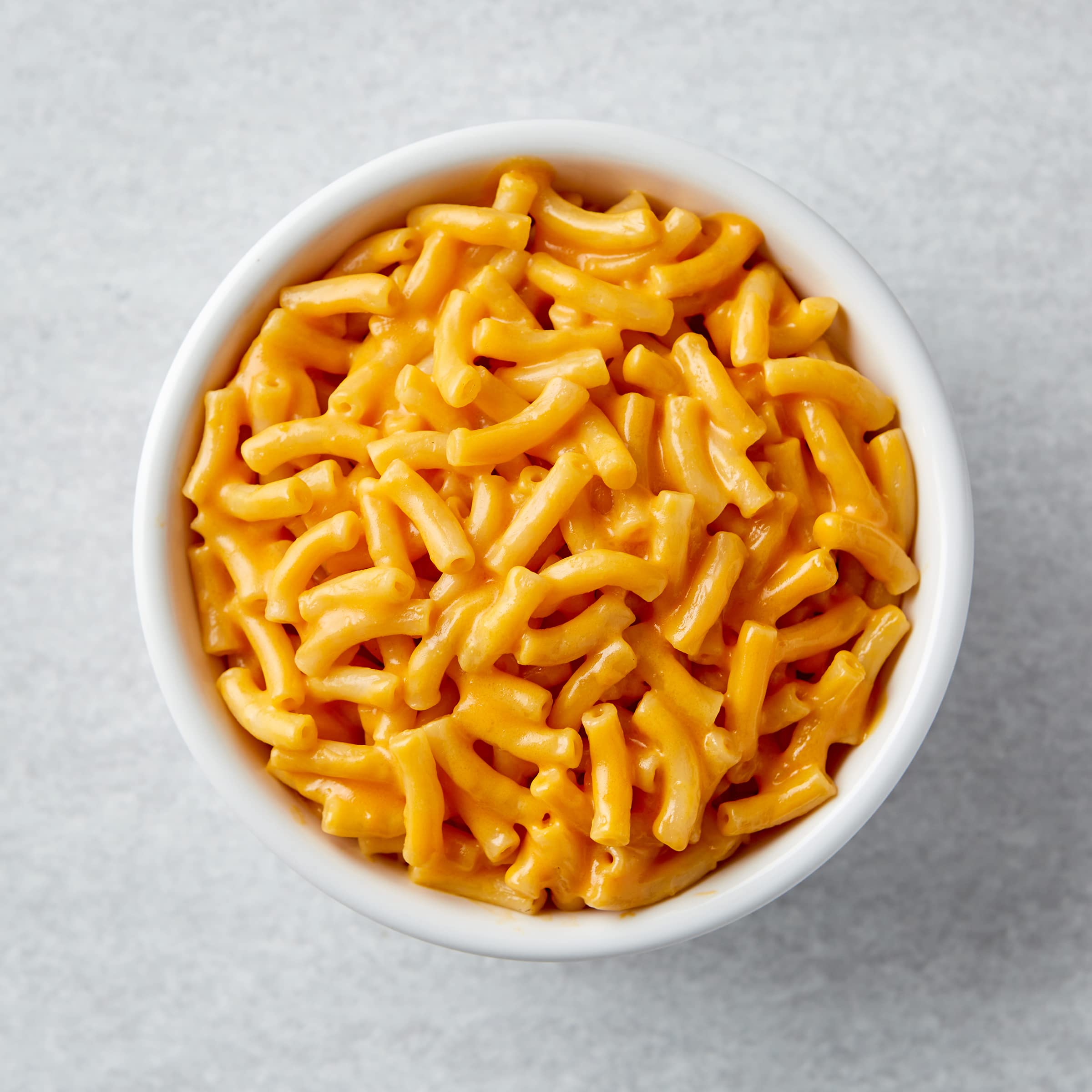 Close-up of Annie's 100% real cheese in macaroni sauce.