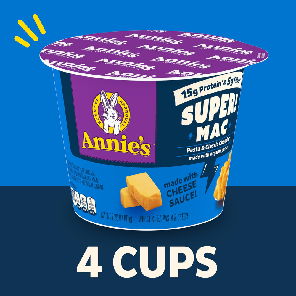 Cheddar sauce being poured over Annie's Super! Mac noodles.