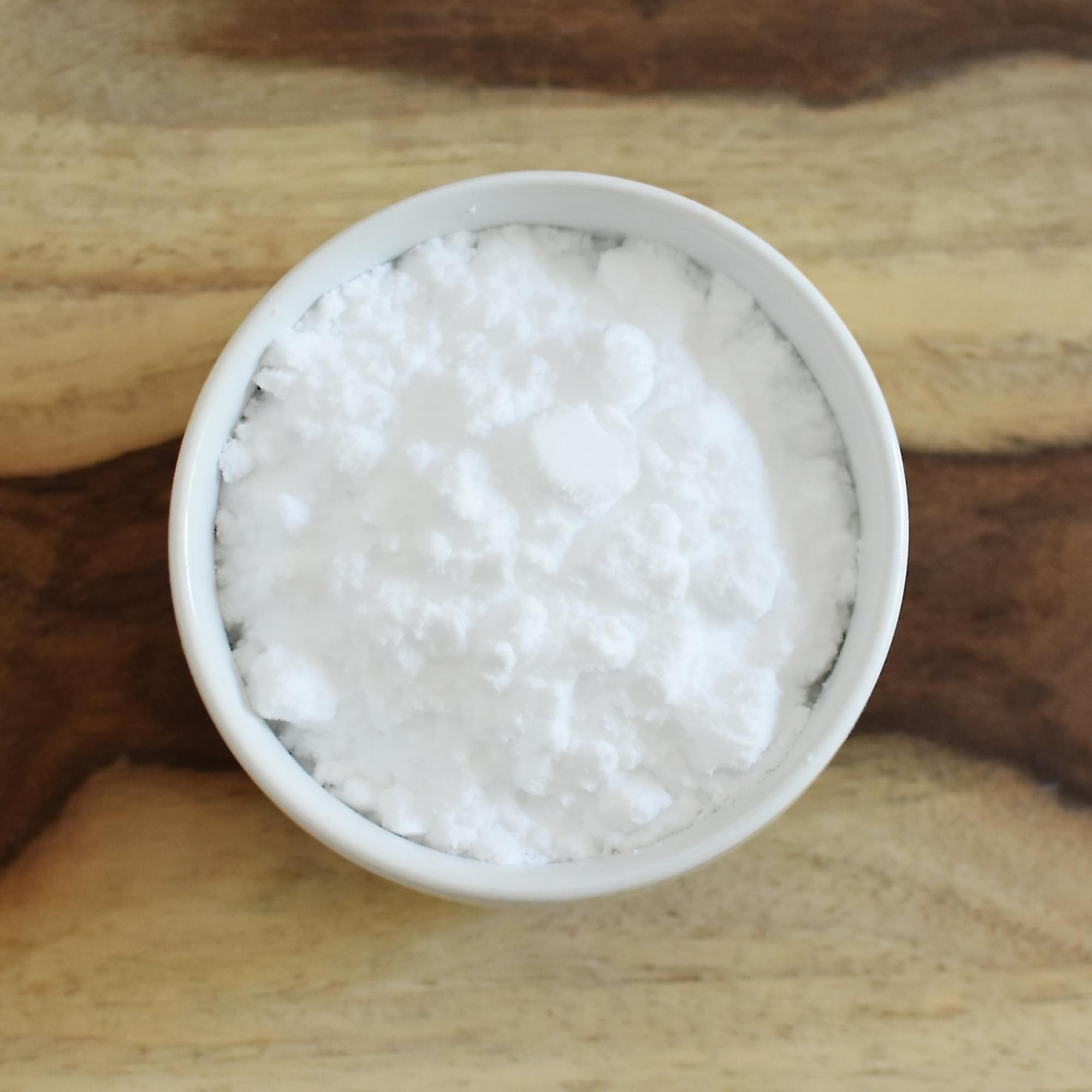 Baked goods setup featuring Anthony's erythritol powder as a powdered sugar replacement.
