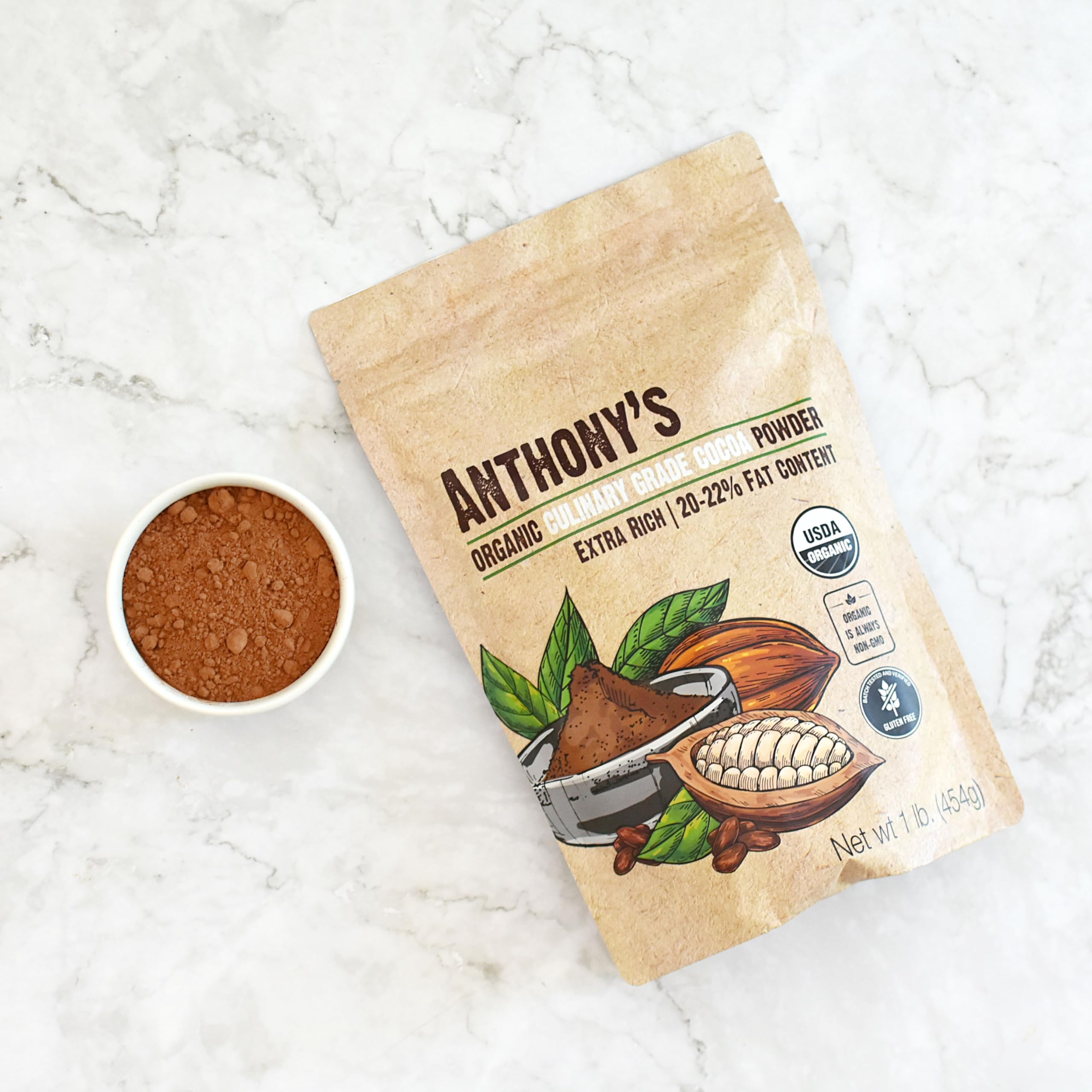 Anthony's Organic Cocoa Powder jar on countertop, perfect for no-bake treats