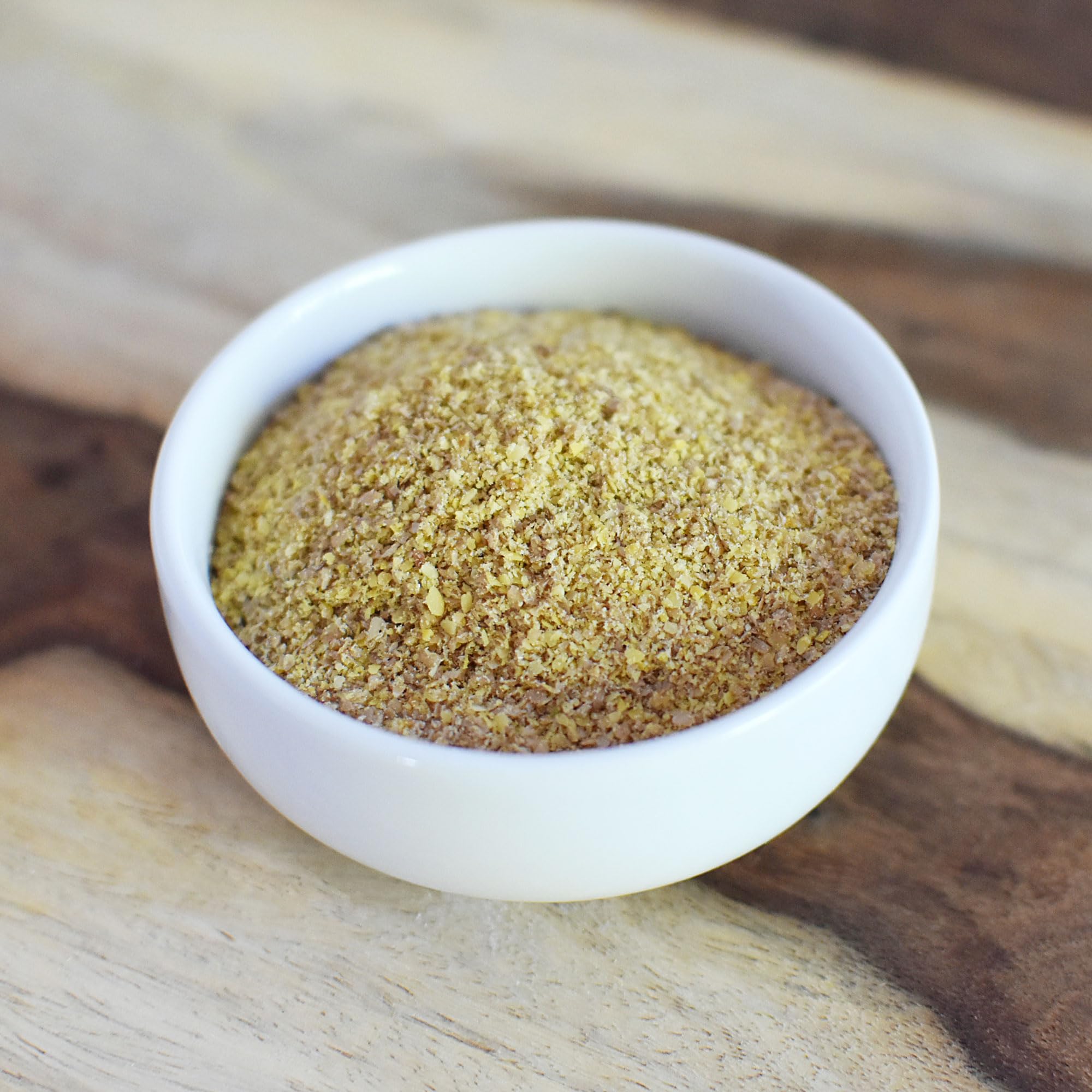 Anthony's flaxseed meal baking close-up, binds dough with subtle nutty aroma.