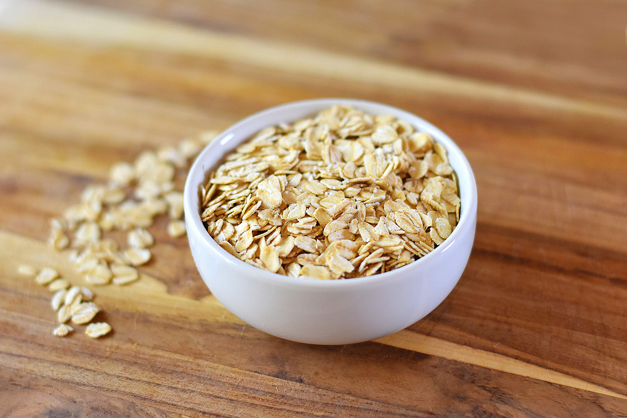 Anthony's Organic Rolled Oats measured for baking, great in cookies and granola bars.