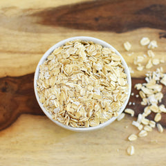 Close-up of Anthony's Organic Rolled Oats, showing whole grain texture for creamy porridge.