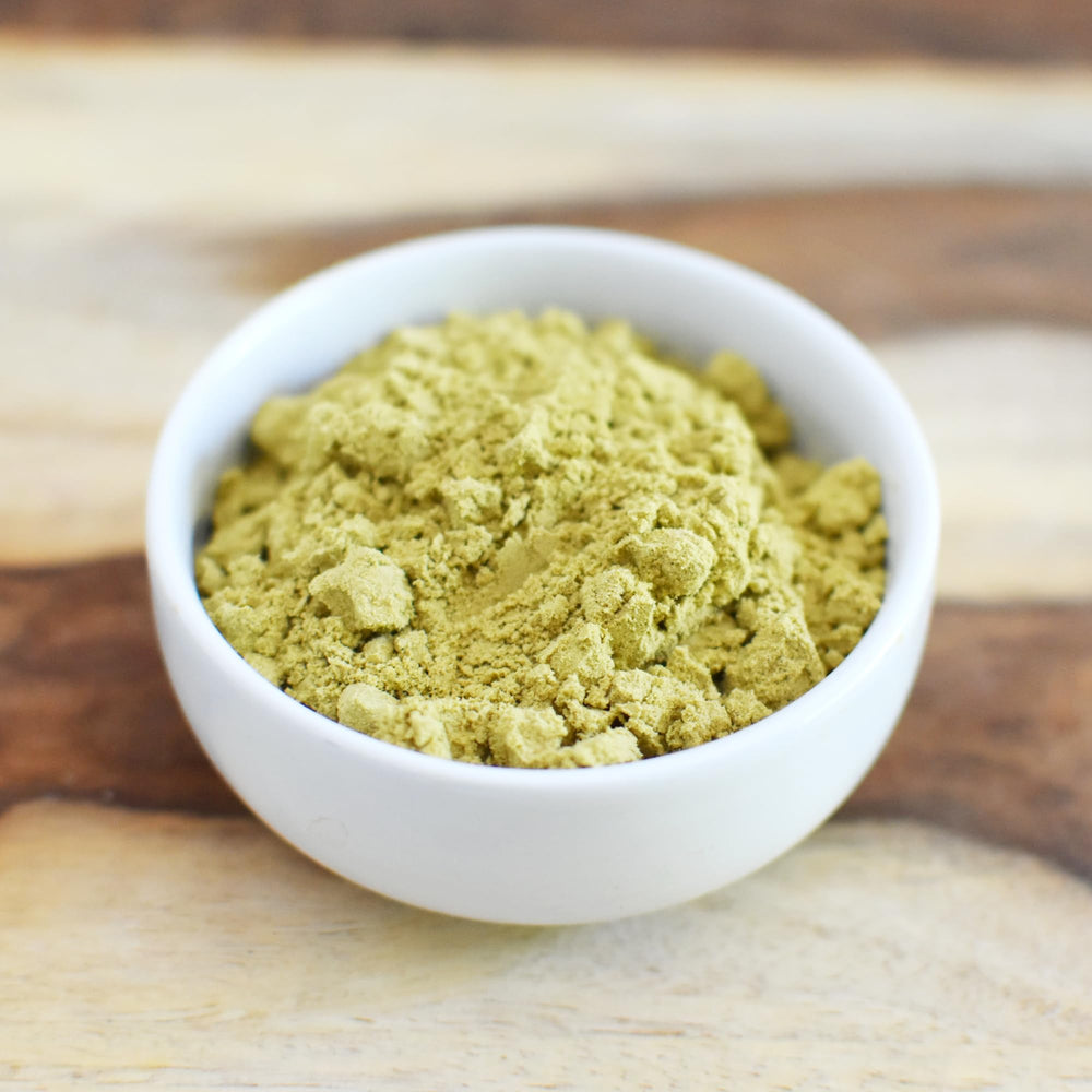 Anthony's pumpkin seed protein powder is poured into a bowl for baking or shakes.