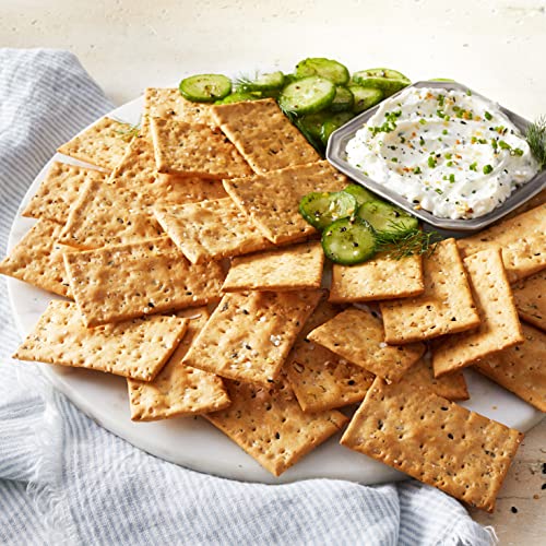 Aplenty Everything Flatbread Crackers on grocery shelf display signals premium snacking.