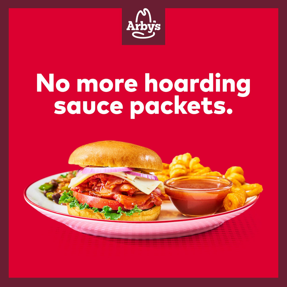Dipping plate with Arby’s Original Sauce beside fries for dipping