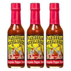 Arizona Gunslinger Red Jalapeño Sauce bottle close-up, bold flavor for tacos.