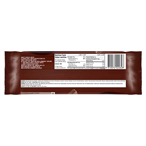 Tim Tam Original served beside a hot beverage, ideal tea-time pairing.