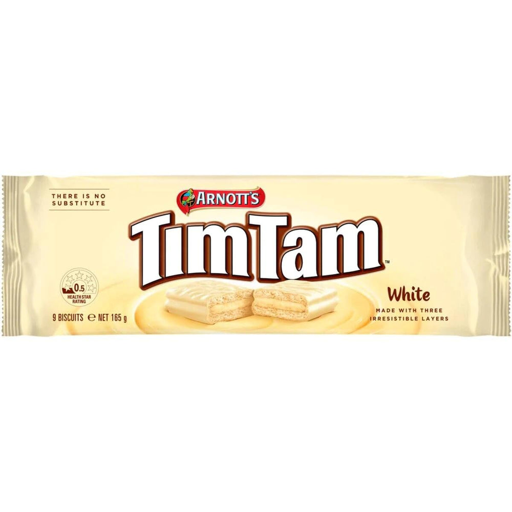 Tim Tam White bite shows dunk-friendly texture for tea or coffee.