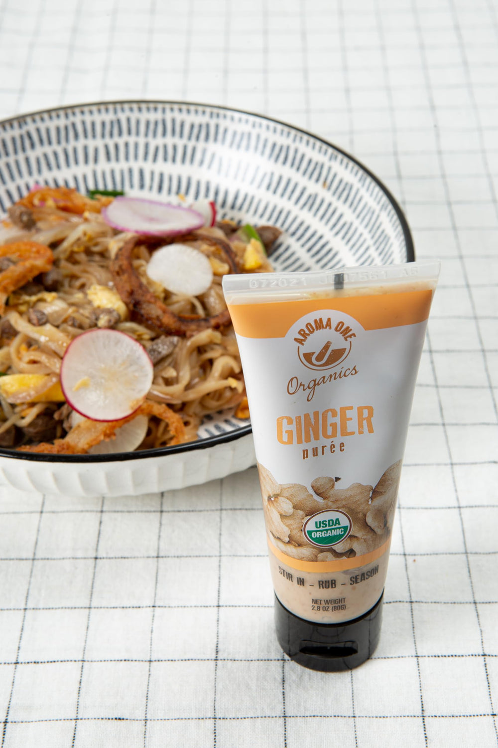 Aroma One ginger puree paste stirred into noodles for bold heat