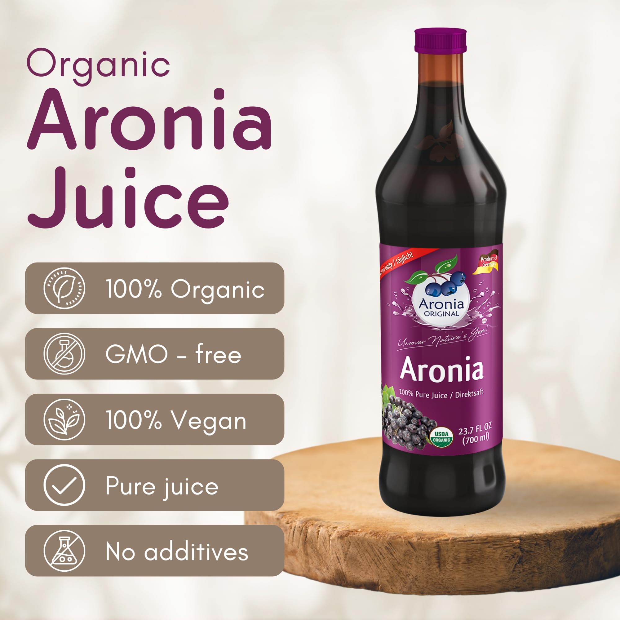 Aronia Original bottle pour into glass for a refreshing, berry-forward pour.