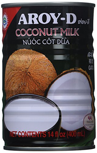Aroy-D coconut milk being poured for curries and desserts