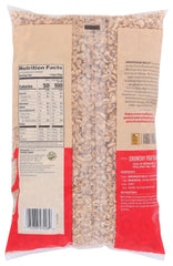 Serving bowl of Arrowhead Mills Puffed Wheat Cereal with milk and berries.