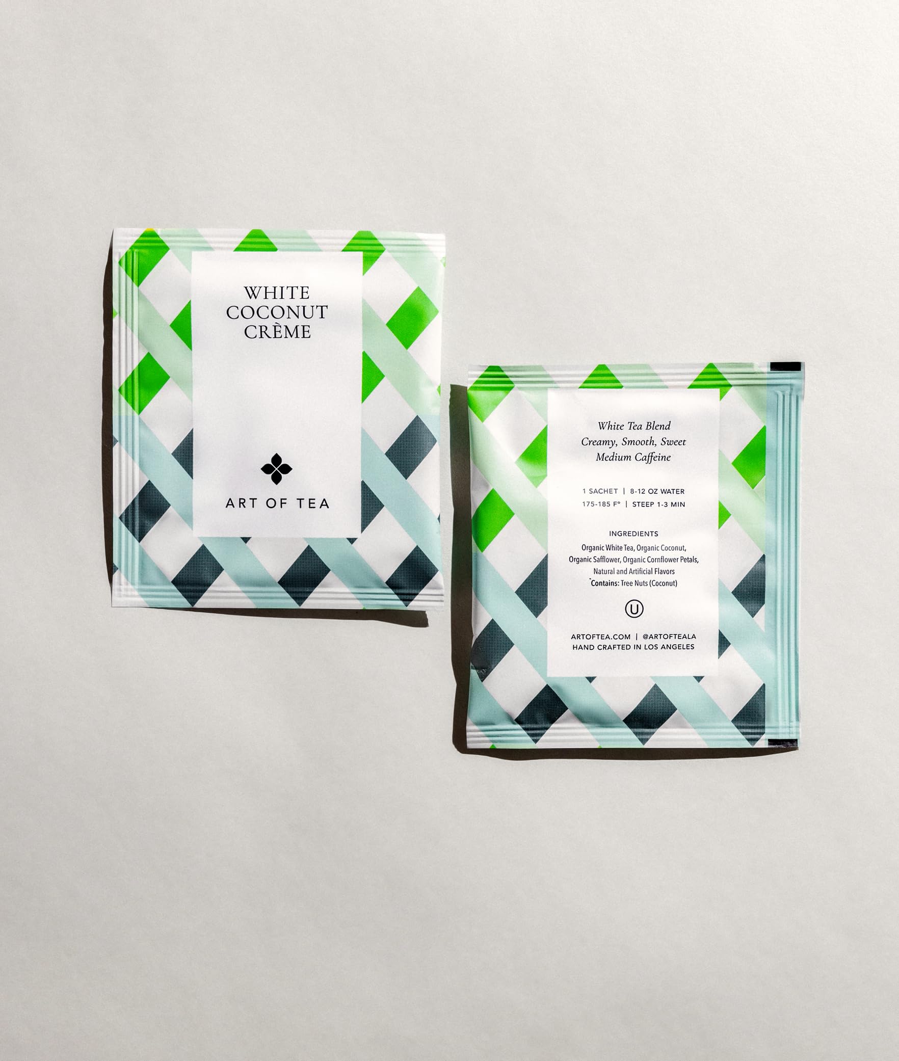 Closeup of Art of Tea sachet showing compostable plant-based packaging.