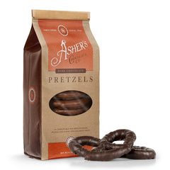 Asher's Chocolates chocolate-covered pretzels closeup showing glossy coating and crisp salt.