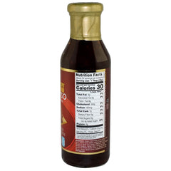 Pouring Asian Fusion General Tso sauce over a sizzling stir-fry for flavor