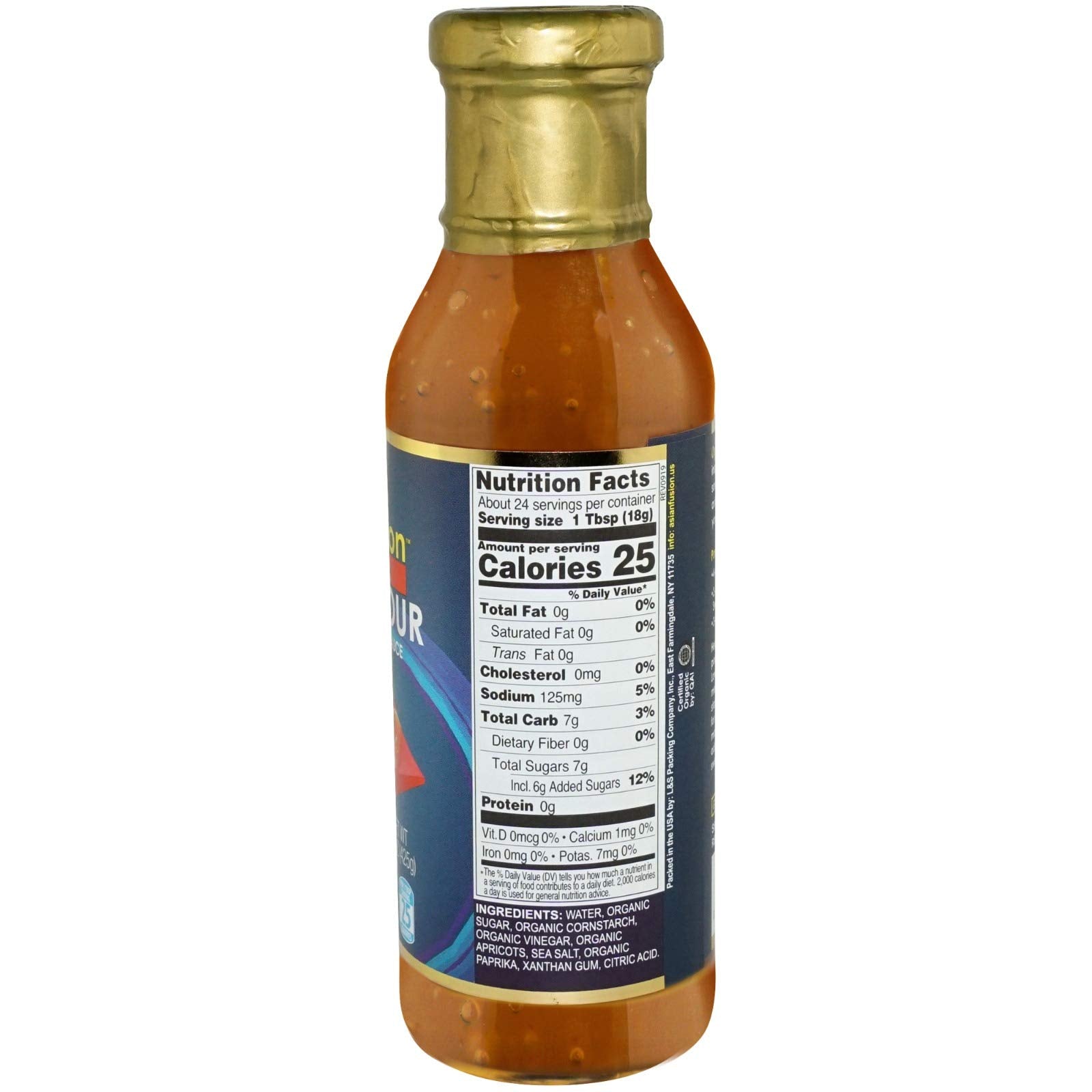 Pouring Asian Fusion Sweet & Sour Sauce over vegetables for quick stir-fry.