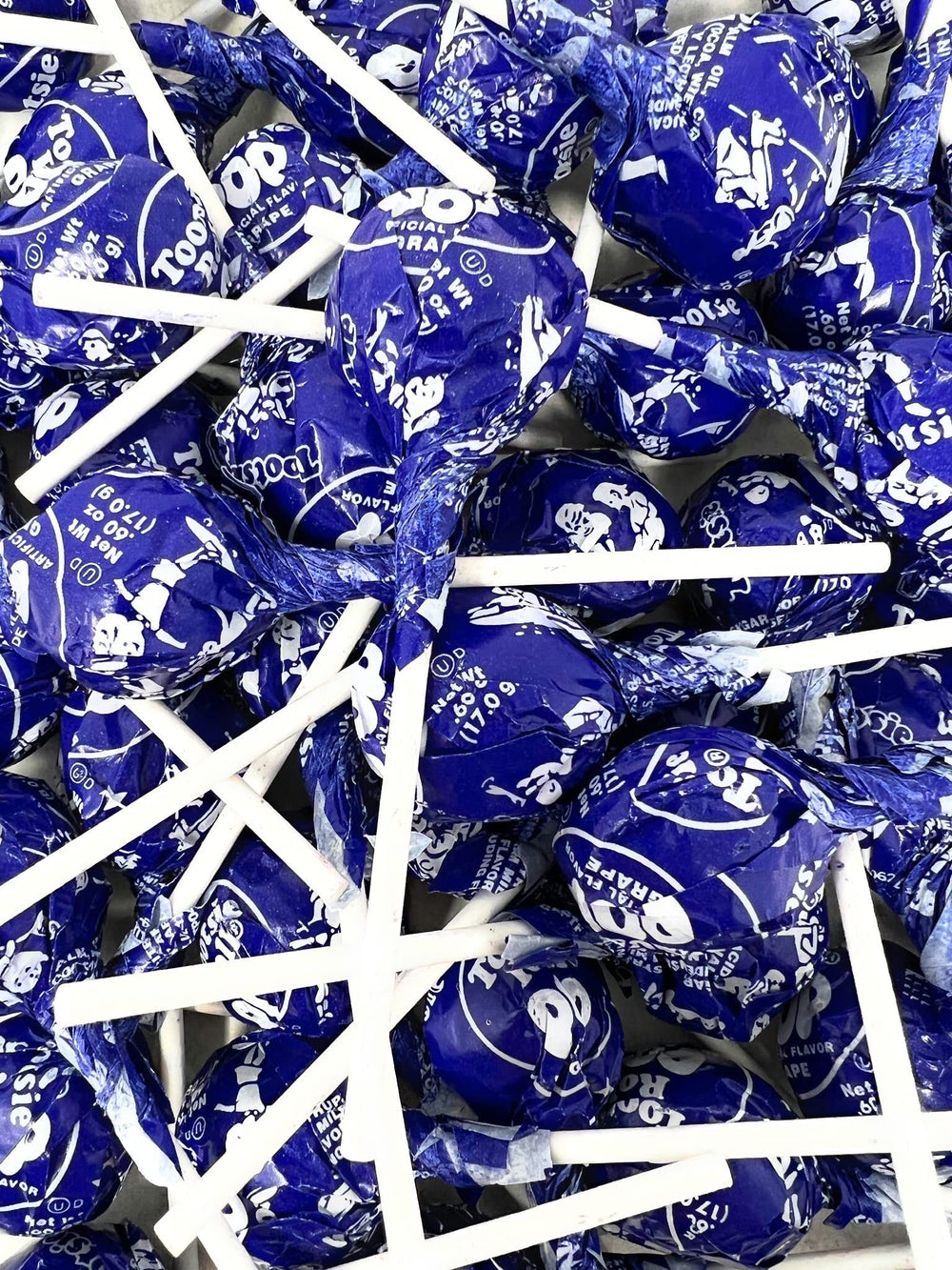 Assortit assortment grape pops displayed for kids events and classroom treats.