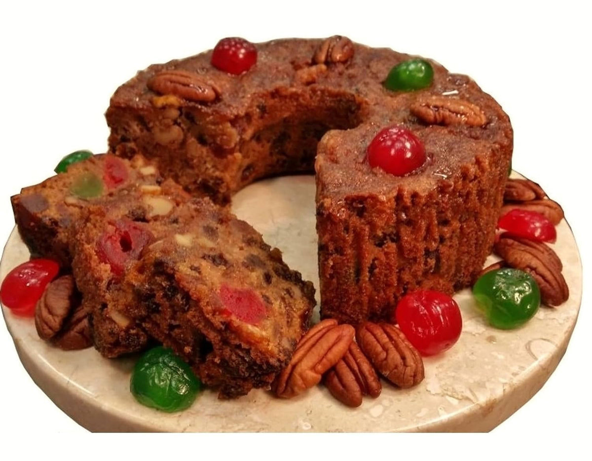 Assumption Abbey fruitcake in traditional tin with rich fruit and nut notes, ideal gift.