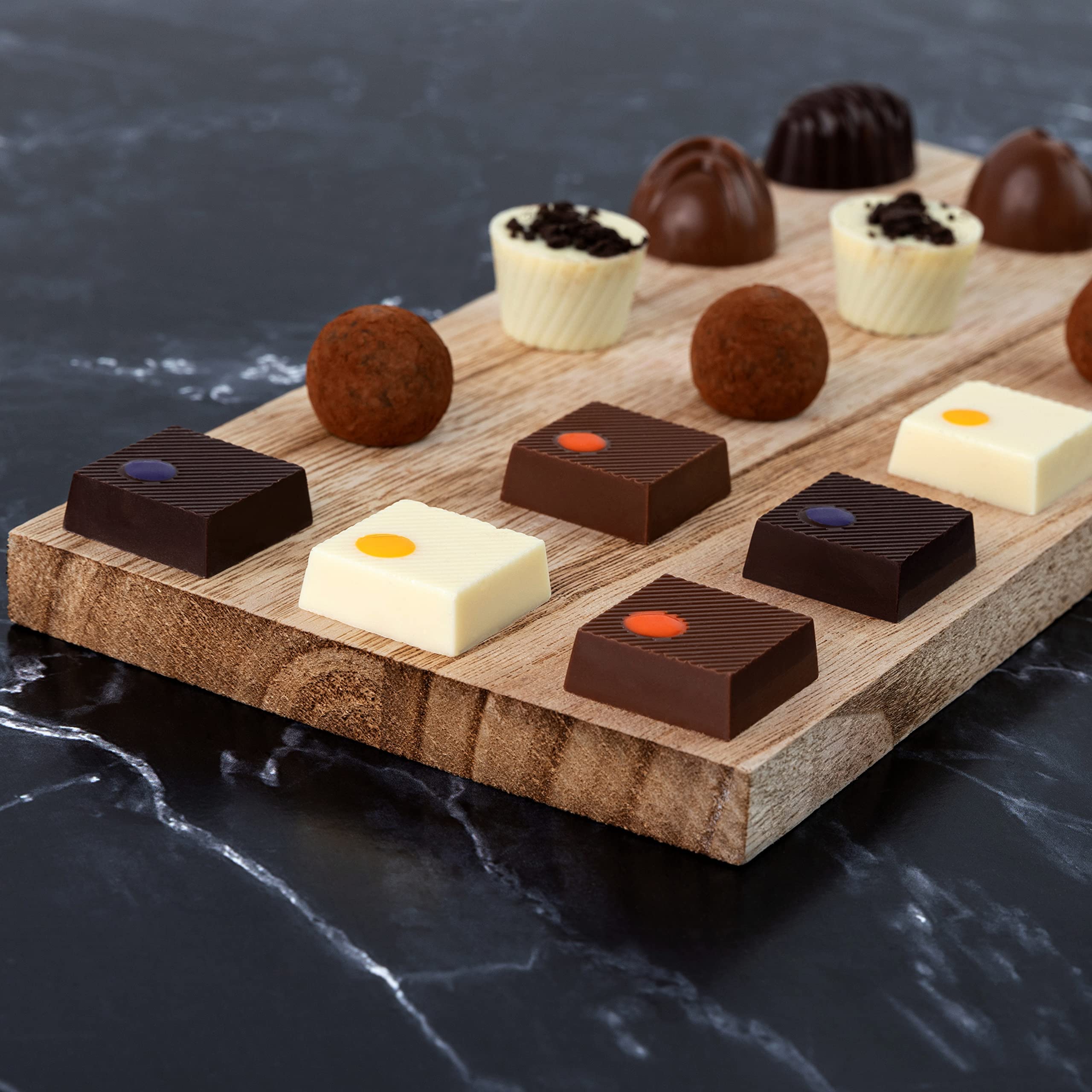 ASTOR Milk Coconut truffle brightens the box.