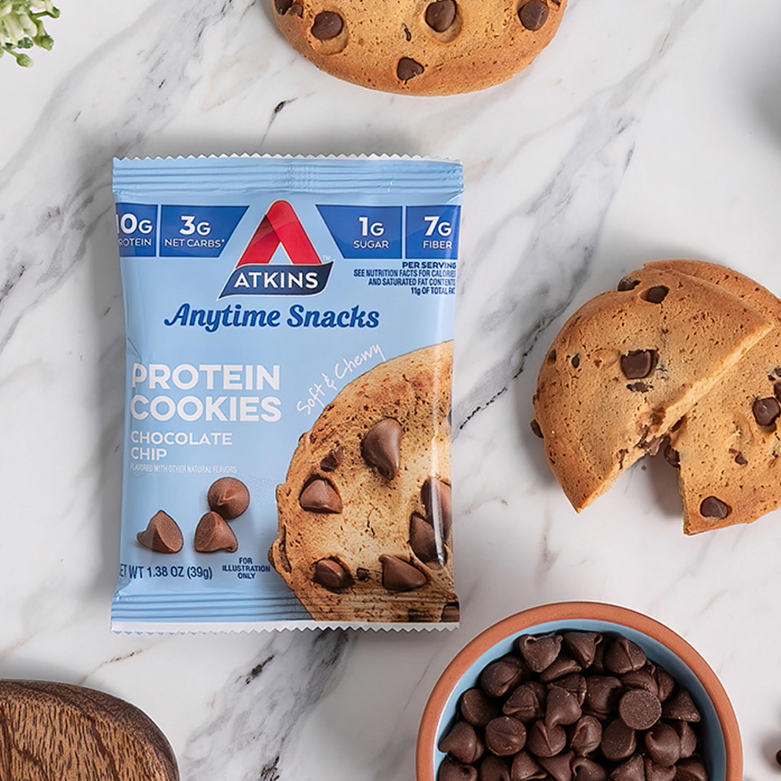 Atkins Chocolate Chip Protein Cookie with glass of milk evokes dessert vibes
