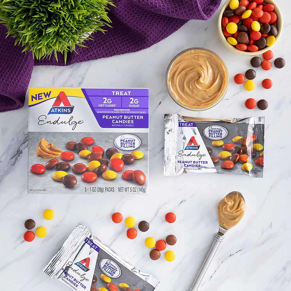 Atkins Endulge on-the-go snack beside coffee for a quick break