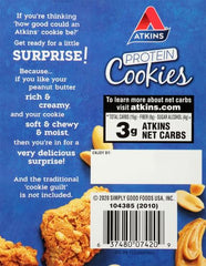 Close-up of Atkins cookie bite shows soft texture and peanut butter richness.