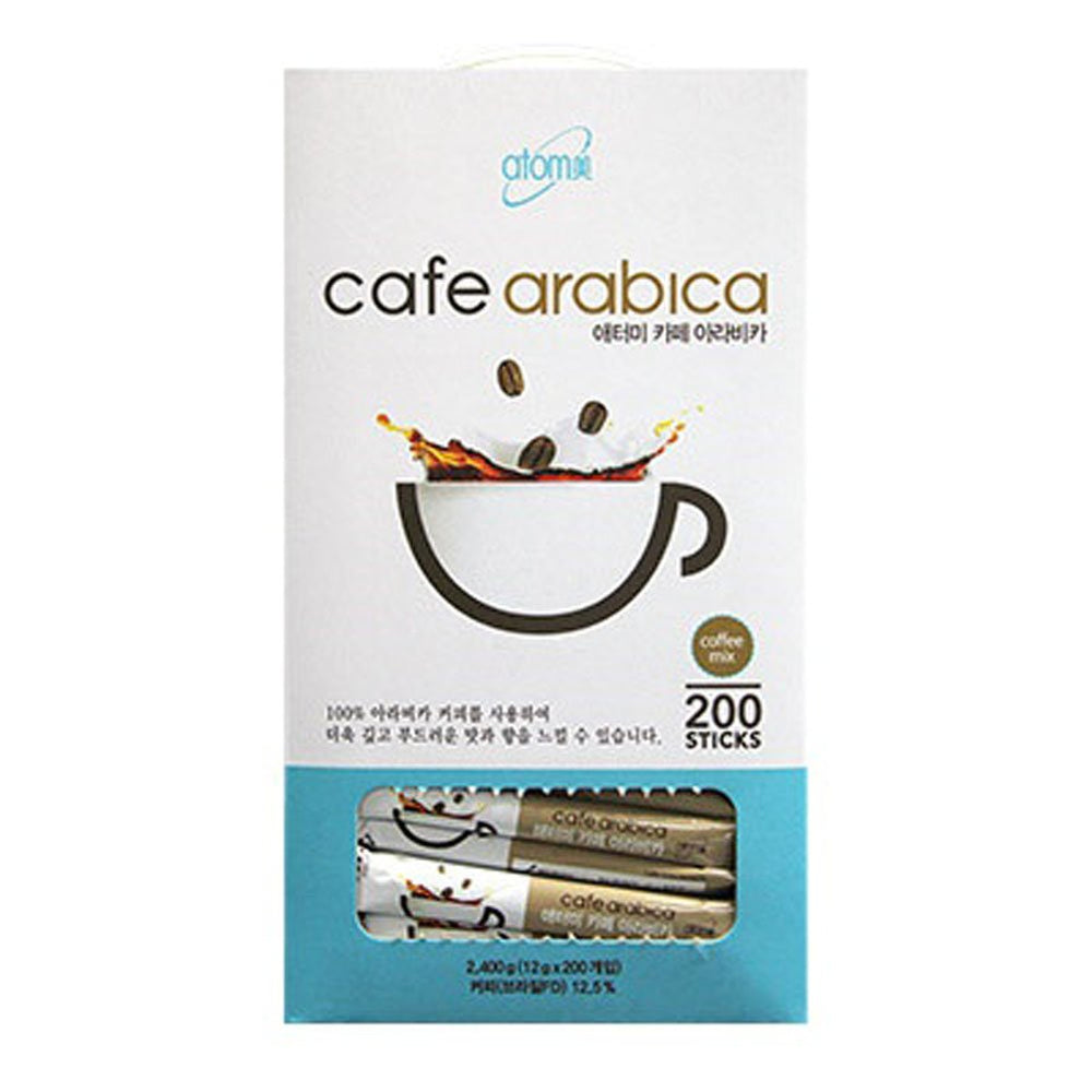 Atomy coffee sticks stirred in a cup to reveal creamy texture.