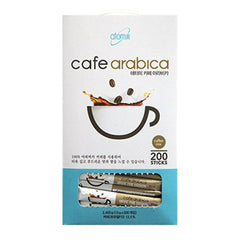 Atomy coffee sticks stirred in a cup to reveal creamy texture.