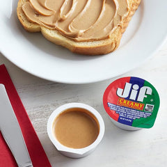 Close-up of creamy ATREVO peanut butter cups showing smooth texture for easy spreading.