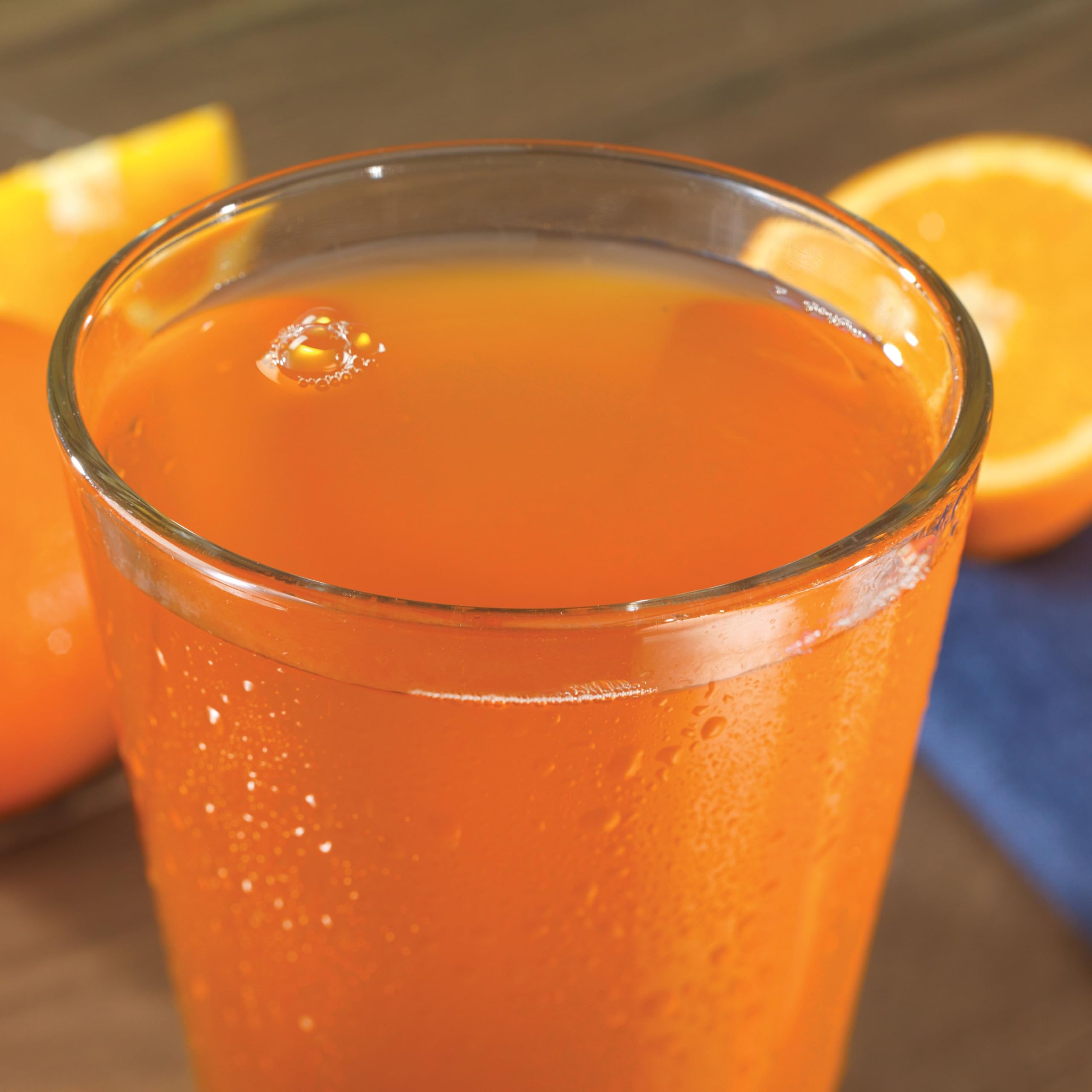 Outdoor camping scene with Orange Delight ready in water.