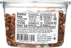 Aurora Products Organic Pecan Halves being poured, a convenient baking ingredient option