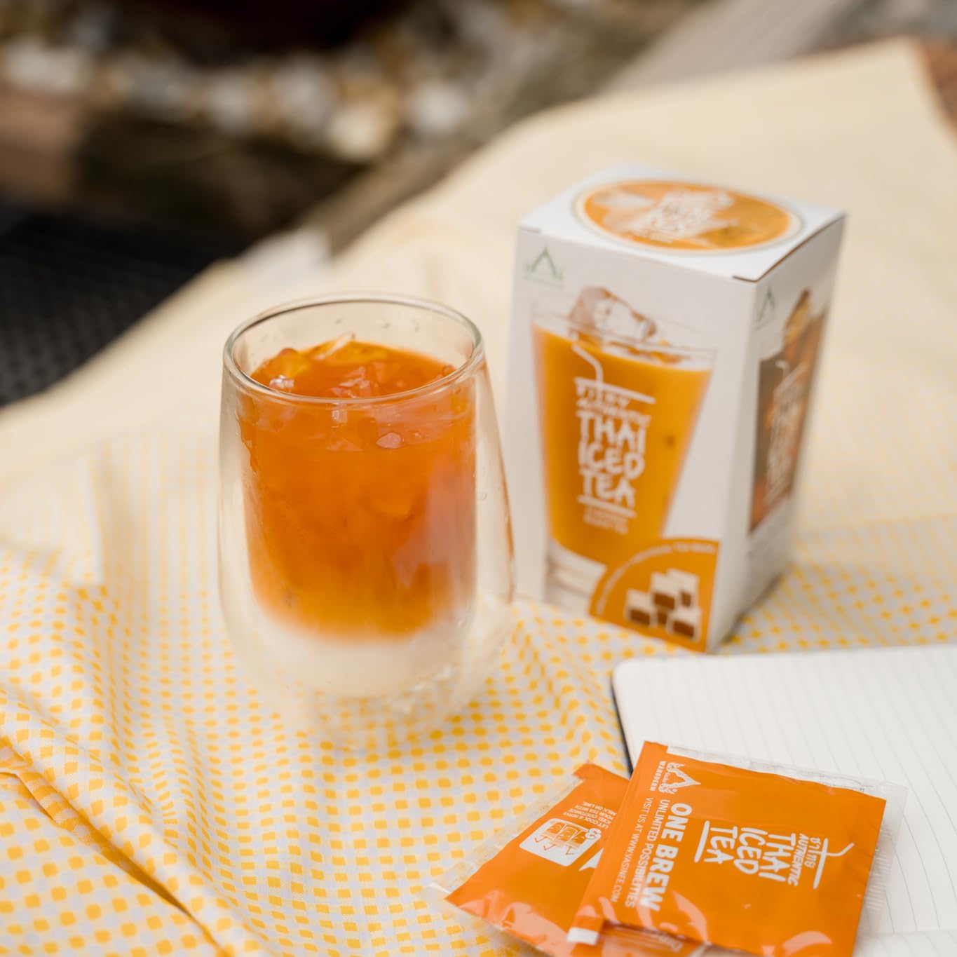 Authentic Thai Iced Tea brew step two with ice and milk for serving.