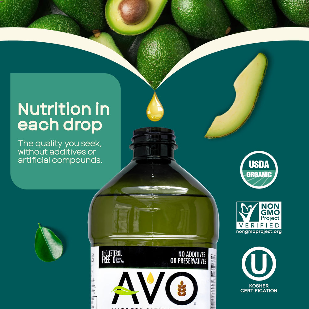 Transparent glass bottle of AVO Organic Avocado Oil on a wooden board.