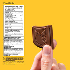 Close-up of AWAKE bites showing creamy peanut butter center and milk chocolate.