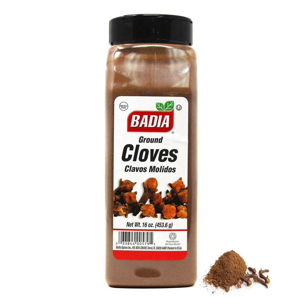 Badia ground cloves bottle pour shows rich aroma ideal for sauces and baking.