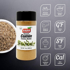 Badia ground cumin bottle pouring into spoon flavors stews and rice