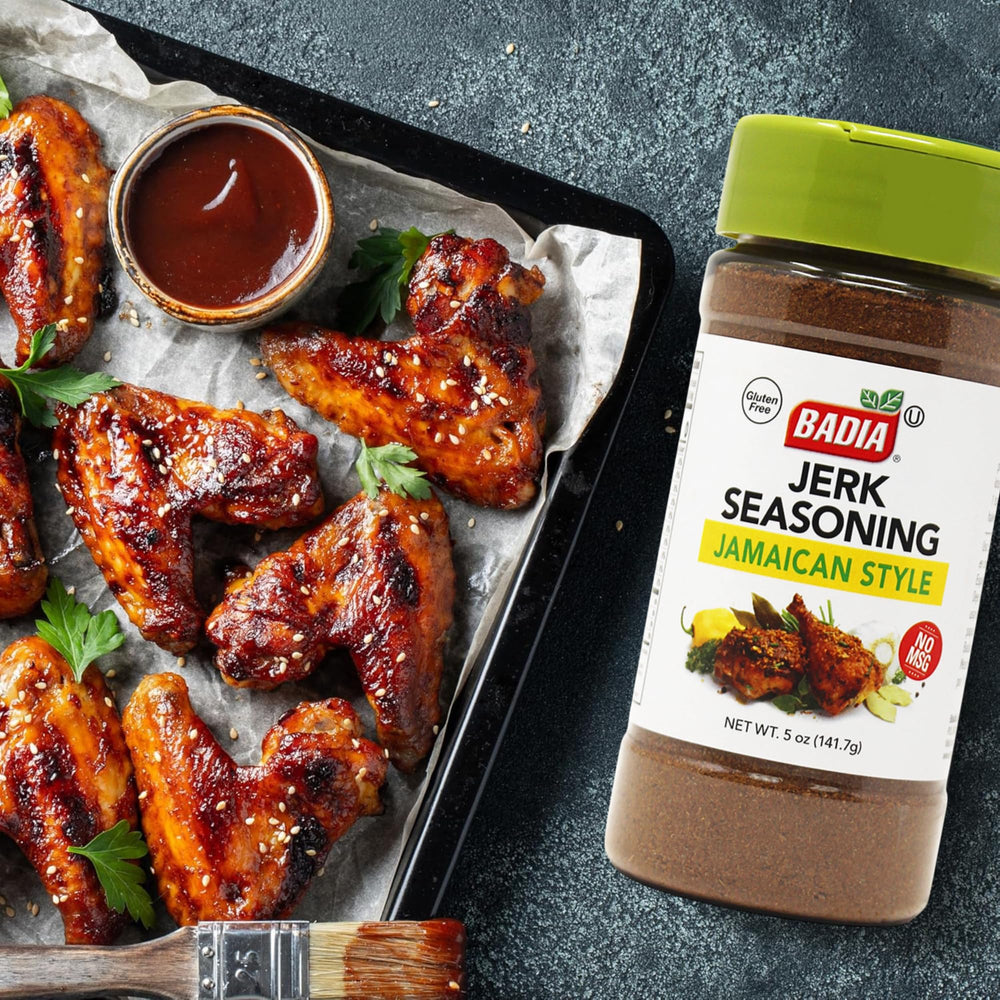 Badia Jerk Seasoning Jamaican Style being poured over meat for flavor boost