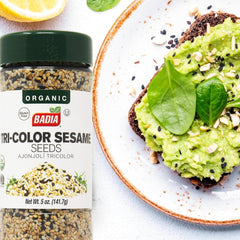 Badia Organic Tri-Color Sesame Seeds on bread—versatile garnish for bagels and avocado toast.