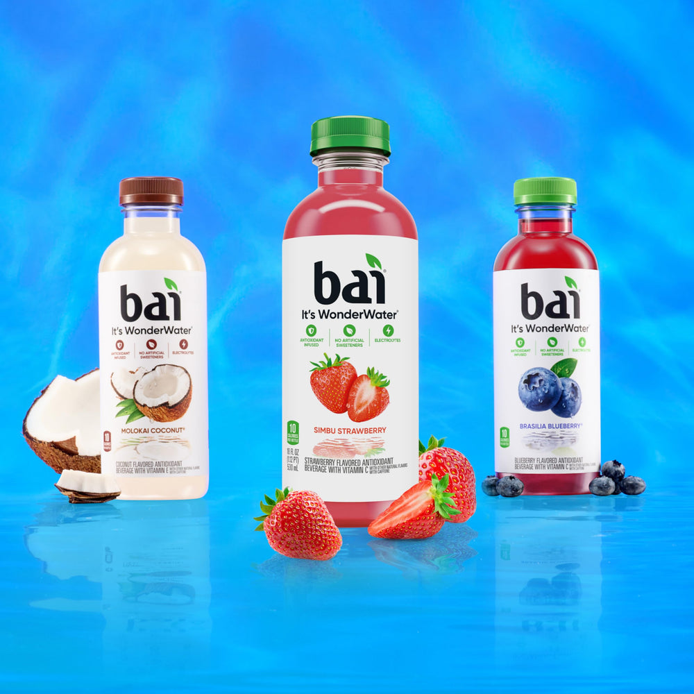 Bai Simbu Strawberry splash into a glass suggests flavorful hydration moments.