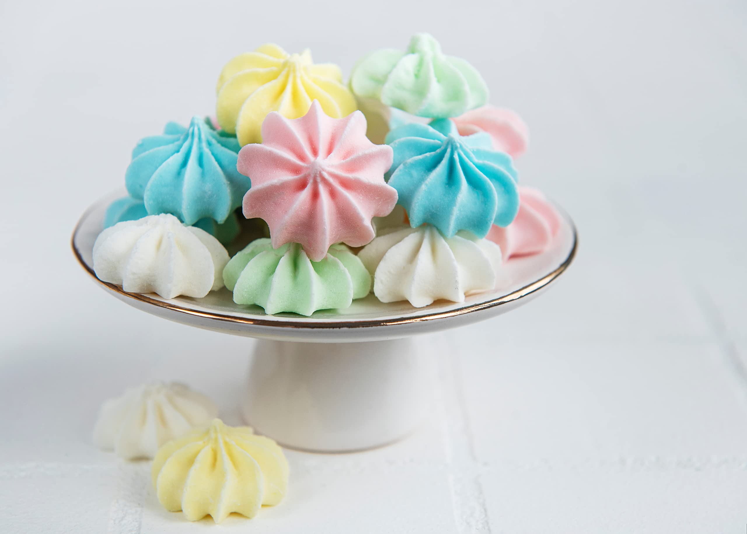 Bakerpan meringue powder beside pastry tools for versatile baking.