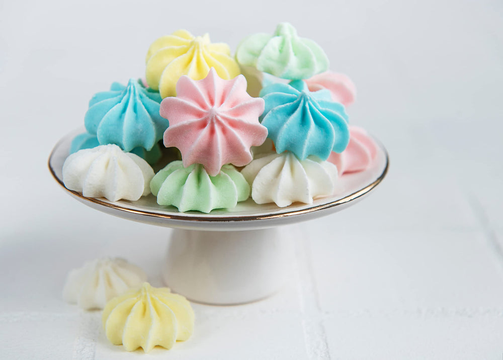 Bakerpan meringue powder beside pastry tools for versatile baking.