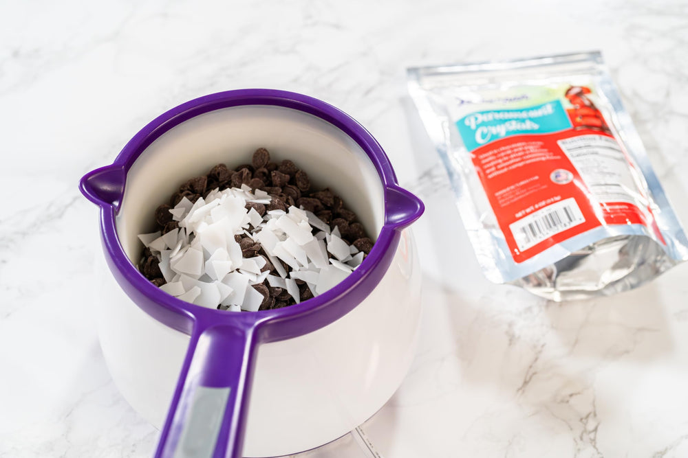 Bakerpan Paramount Crystals keep yogurt coatings fluid for even coverage.