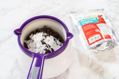 Bakerpan Paramount Crystals keep yogurt coatings fluid for even coverage.