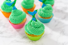 Bakerpan fondant smoothly covers a cake for a professional finish.