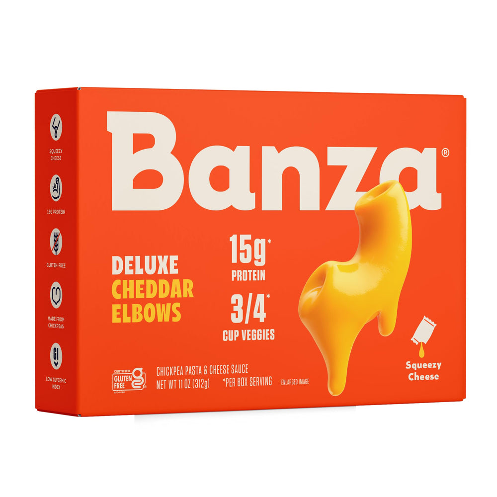 Banza Deluxe elbows mac and cheese with creamy cheddar sauce being poured for a quick, protein-rich weeknight dinner.