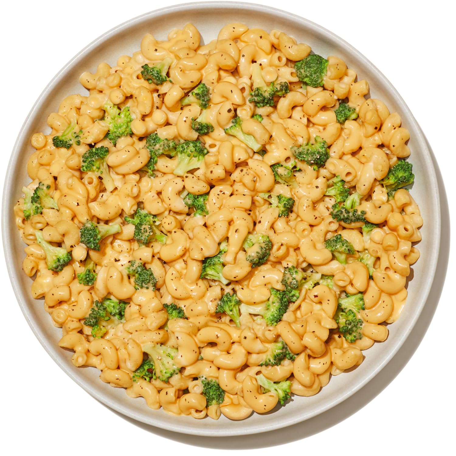 Banza Elbows pasta with pesto on plate, showcasing versatile pairing