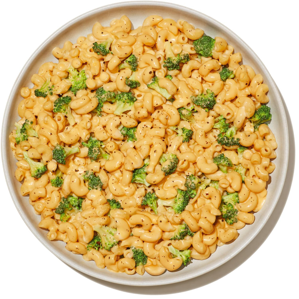 Banza Elbows pasta with pesto on plate, showcasing versatile pairing