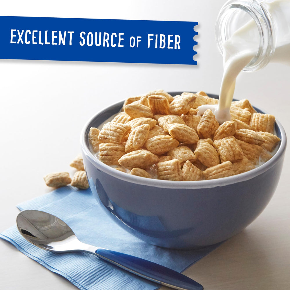 Pouring milk over Puffins cereal, ready for a bowl