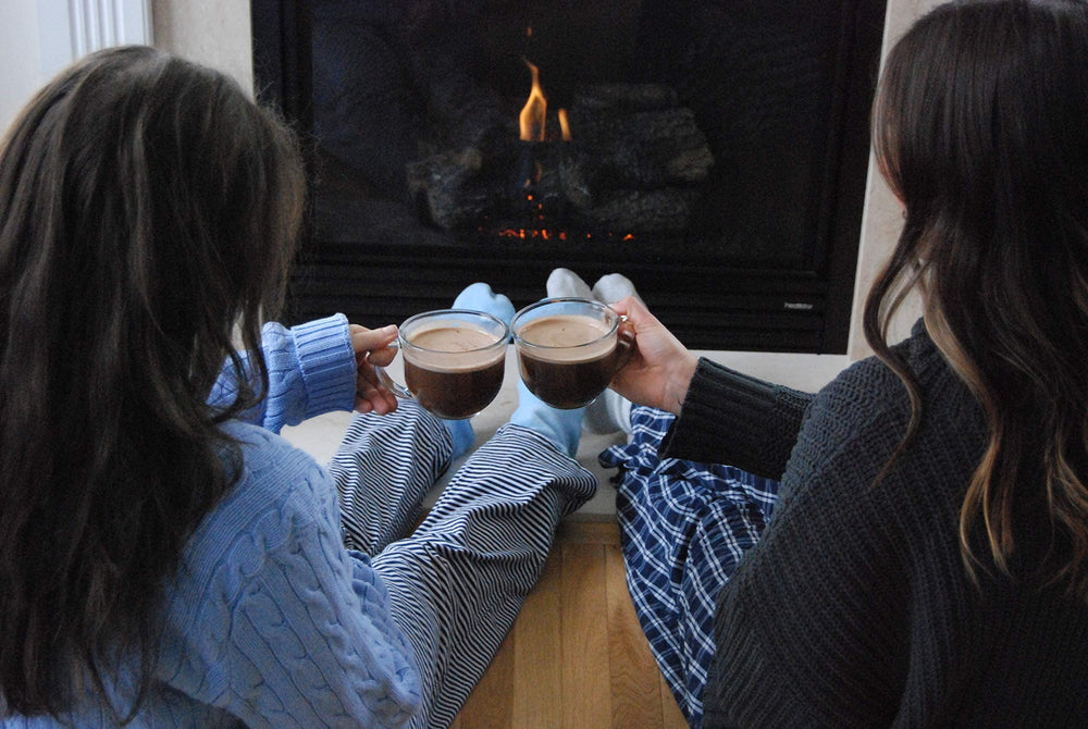 Bare Life cocoa cup on a cozy desk setup with a blanket